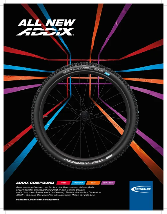 Werbung für Fahrradreifen, Hintergrund schwarz mit bunten Strichen